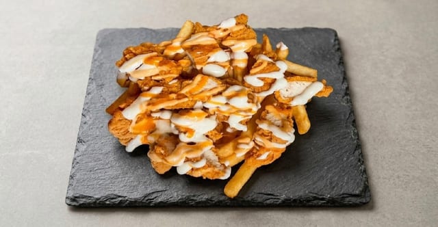 Chicken Tender Over Fries.