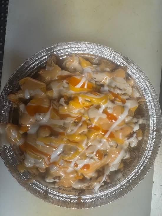 Chicken Tender Over Fries.